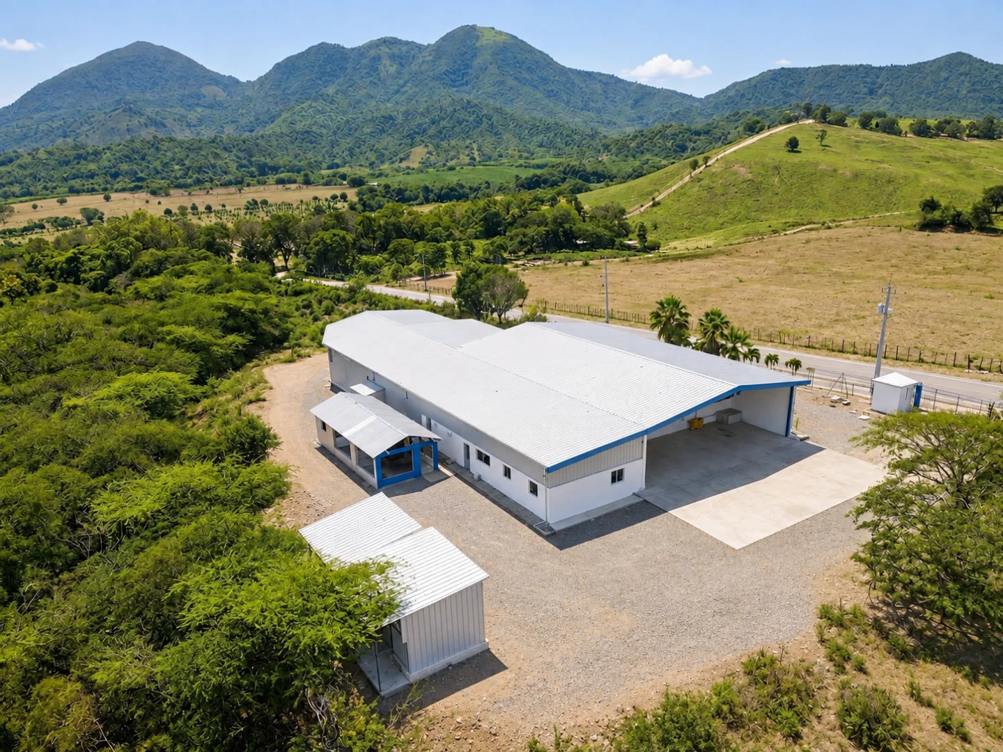 Caribbean farm surrounded by green hills