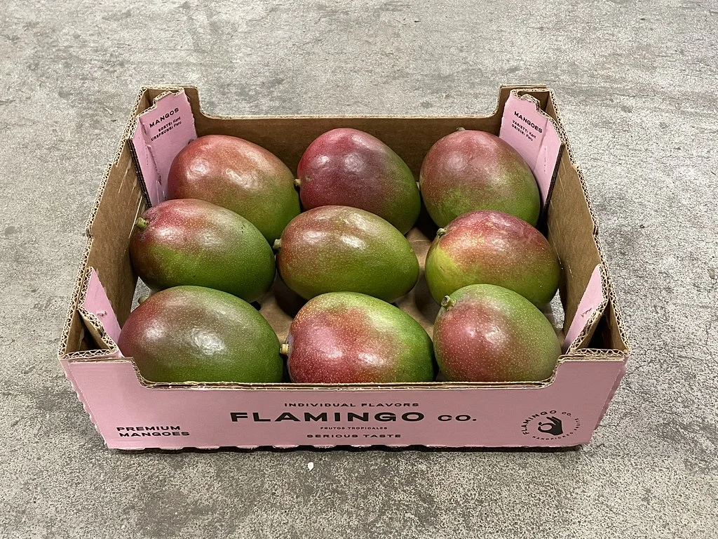 Fresh mangoes in a Flamingo box